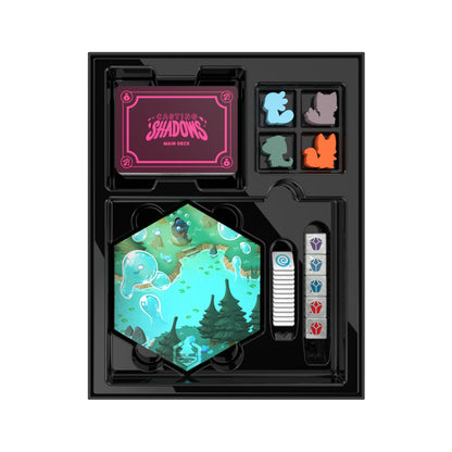 An open Kickstarter-funded Casting Shadows: Base Game box featuring hexagonal tiles, colorful player tokens, decks of cards, and a themed score tracker by Unstable Games.