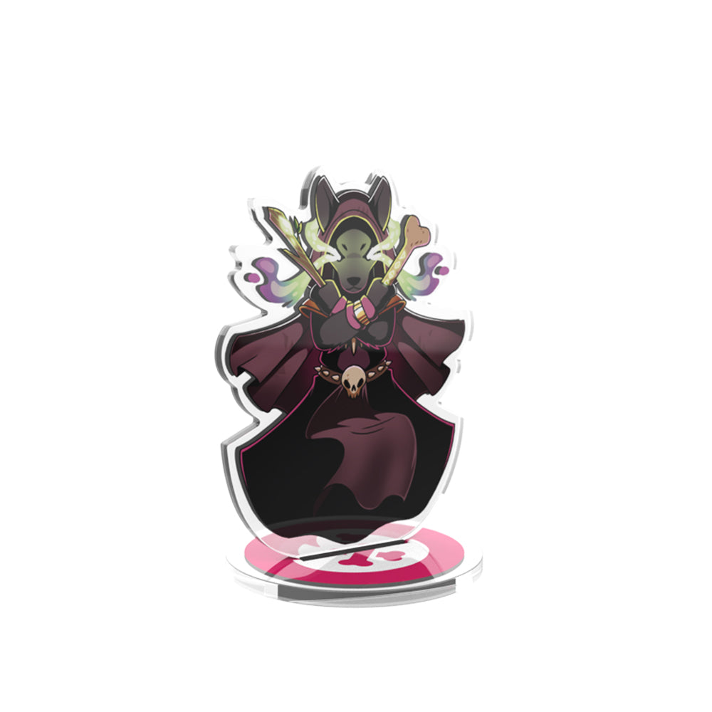 Illustration of a fantasy character from the "Here to Slay: Berserker & Necromancer Expansion Standee Set" with green skin and pointed ears, wearing a dark cloak and adorned with mystical jewelry, displayed on an acrylic by Unstable Games.